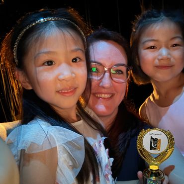 Music students with their teacher at Cyril Clark Theatre with Synergy Music Academy