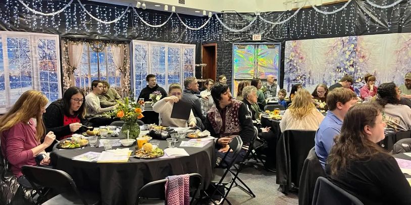 people at tables eating