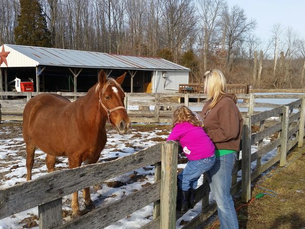 Woman and child with horse.