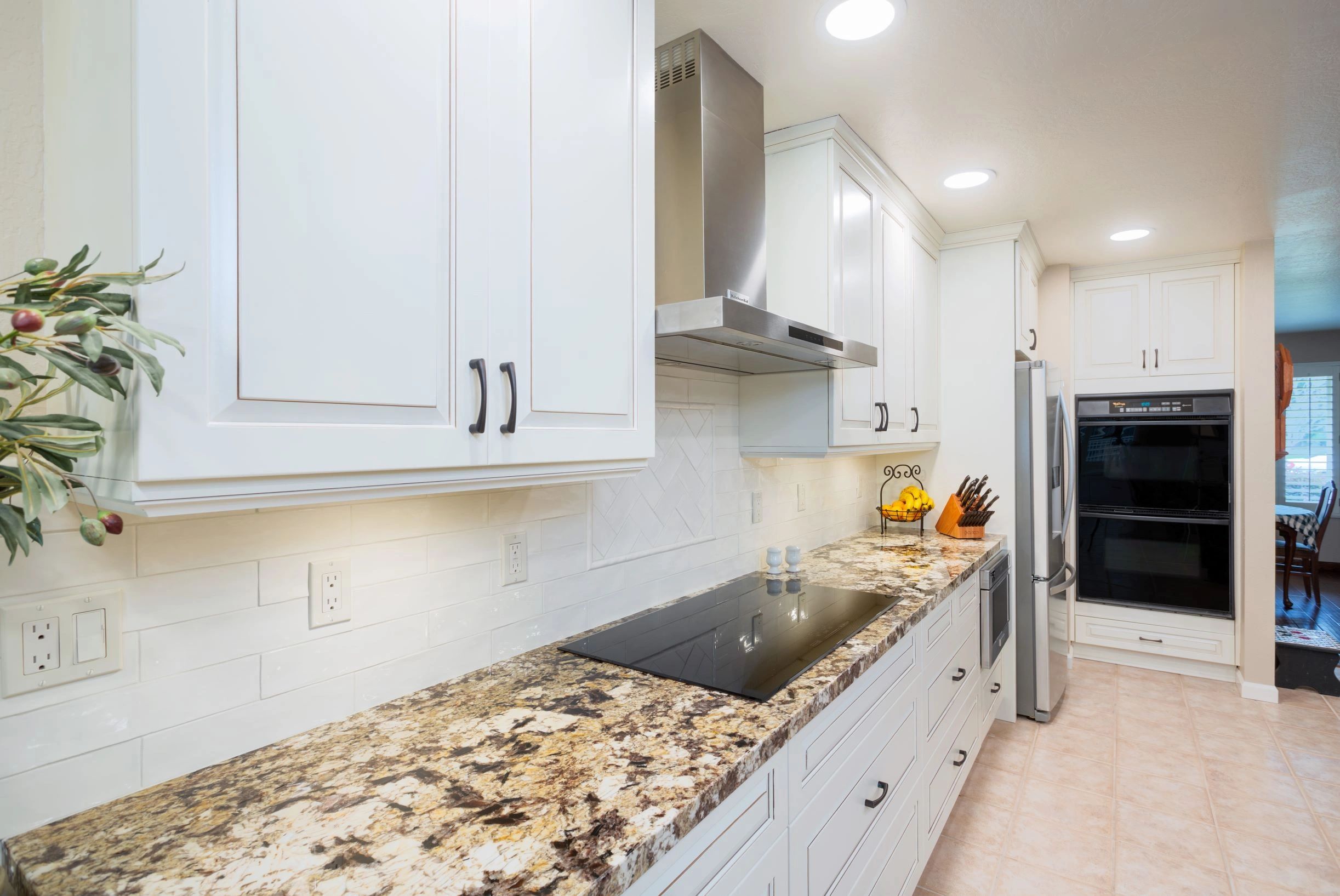 White kitchen, with granite countertops