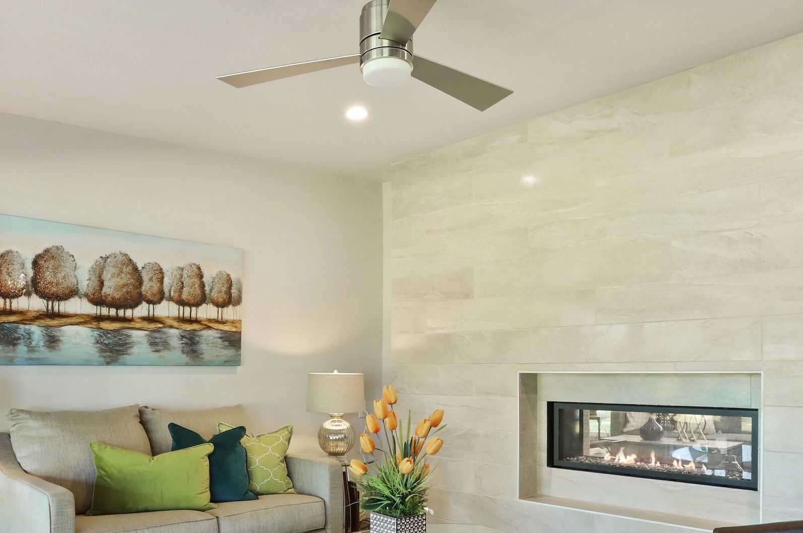 A linear fireplace adds warmth and design.
Tile Wall Fireplace 
