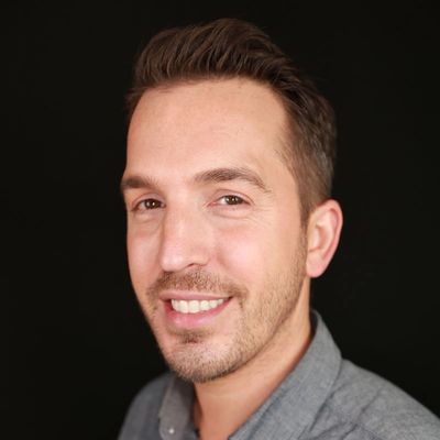 A headshot of a man with short brown hair.