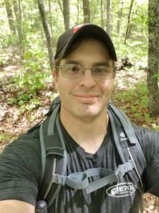 Tony in the woods hiking the Appalachian trail