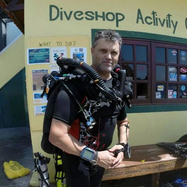 Darrell with dive gear on during a dive trip to Bonaire