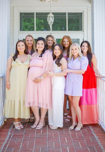Baby Shower guests posed outside together.