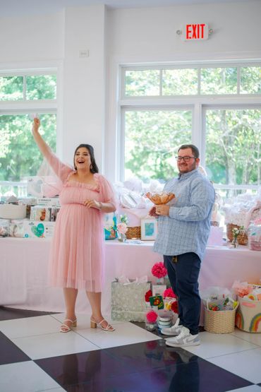Mom and Dad to-be opening presents.