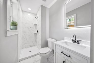 Transformed from a tight, dark bathroom, to this bright open, and airy design for our client.