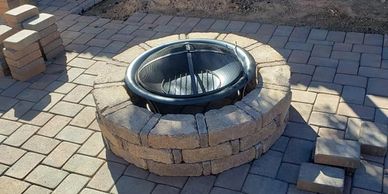 Hardscape project for a new fire pit and patio pavers.