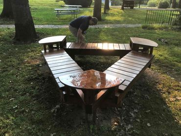 Park bench made from reclaimed redwood boards.