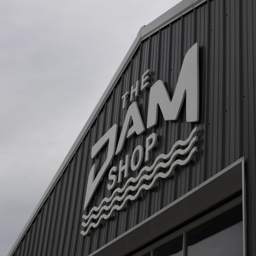 The DAM Shop Logo