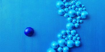 A blue background with multiple balloons