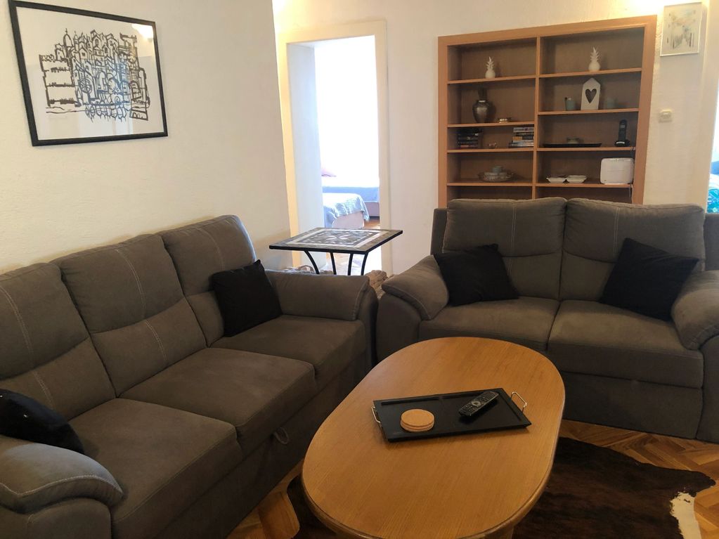 Open Living room with grey couches