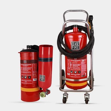 Two red fire extinguishers labeled 'Cease Fire' with one on a wheeled cart.