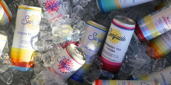 Cans of Surfside flavored vodka beverages chilling in ice.