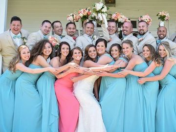 A newly-wed couple with their bridesmaids and best men