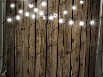 Dark wood with string lights for photo booth rentals and video guestbook activations.
