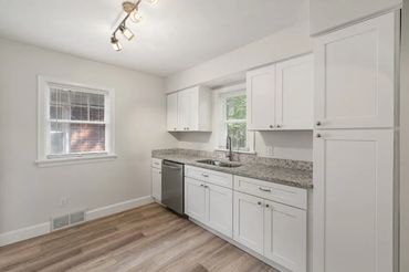 Property flip with new kitchen layout, plumbing, appliances, and flooring.