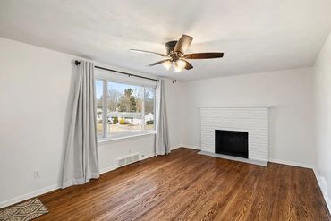 Installation of lighting fixtures, fans, painting, and wood floor resurfacing