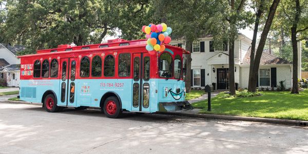 The Jolly Trolley in front of a house for a birthday party.