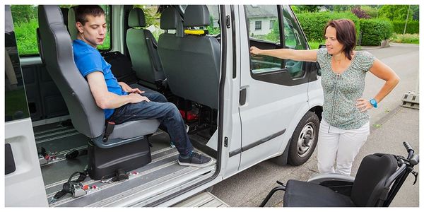 A sick patient coming down from a Vehicle