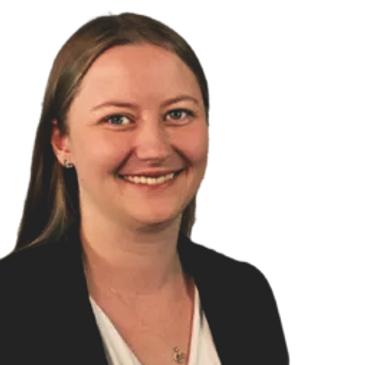 Smiling woman with light brown hair in business attire.