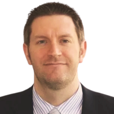 Professional man in suit and tie, smiling.