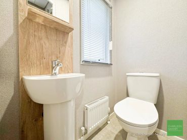 Simple bathroom with a white sink and toilet.