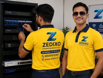 Two men in yellow Zedixo shirts working with network equipment.