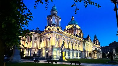Belfast City Hall lit up in yellow to mark our 5th birthday