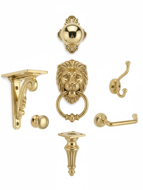 Set of ornate gold-plated hardware including lion door knocker, hooks, and brackets.