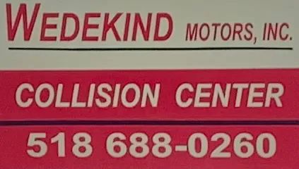 Sign for Wedekind Motors Collision Center with phone number.