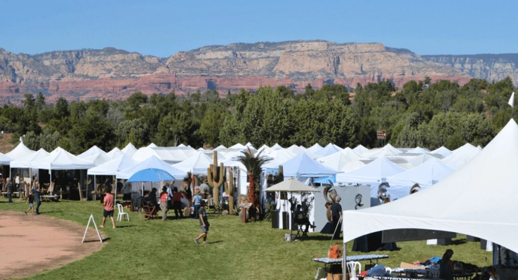 Bustling tents set against red rock vistas at the Sedona Arts Festivalβa vivid snapshot of the creat