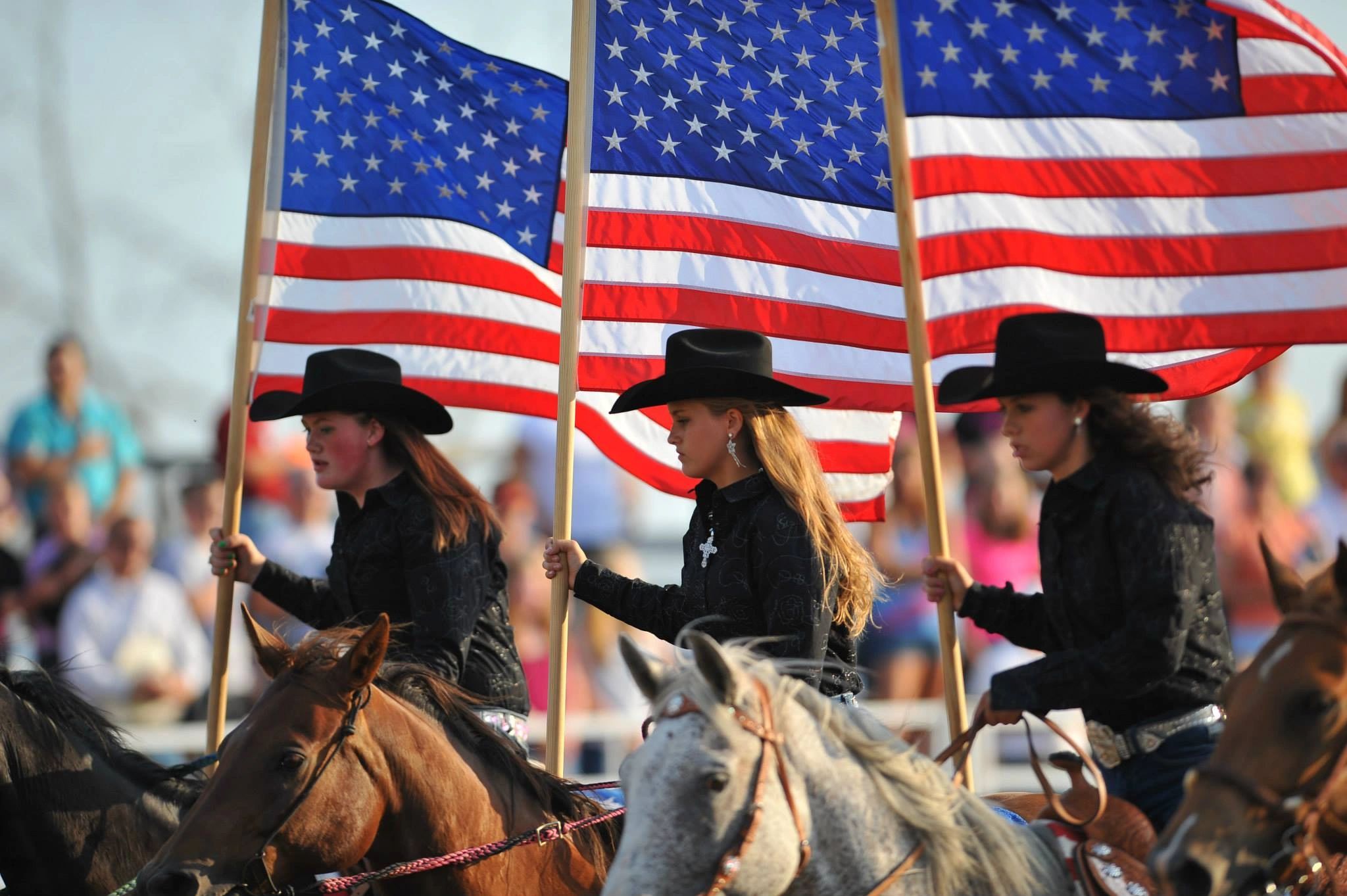three drill team girlswith flags