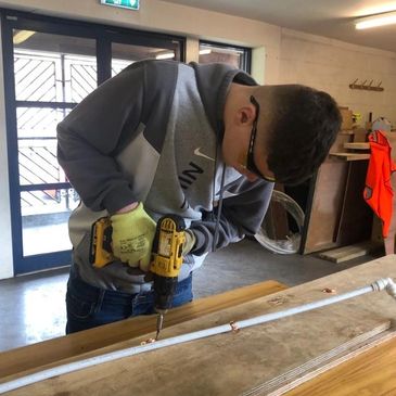 CAST Angling Project student learning the correct use of a drill