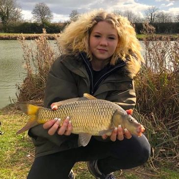 CAST Angling Project student holding a Common Carp caught on a Nottinghamshire Lake