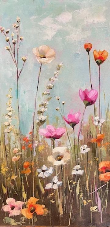 Colorful wildflowers against a soft blue sky.
