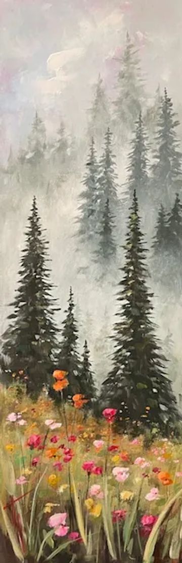 Mist-covered pine trees with colorful wildflowers in the foreground.