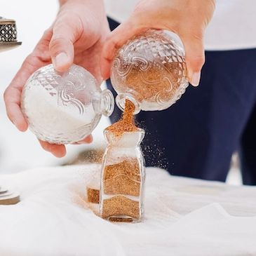 Illustration of a sand ceremony as part of a wedding.