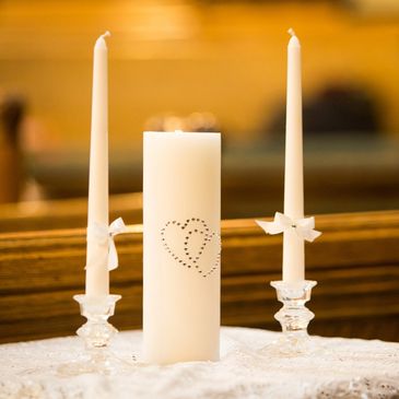 Illustration of a unity candle ceremony as part of a wedding.