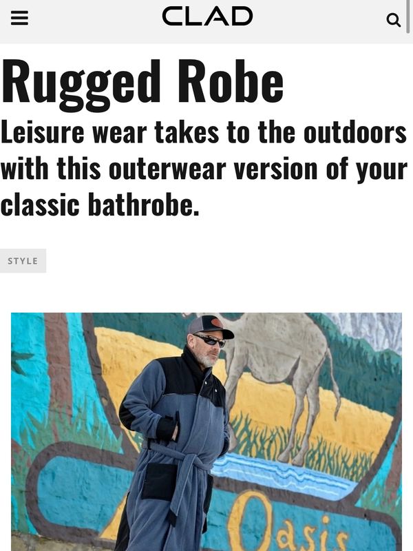 Leisure wear takes to the outdoors! rugged robe man standing in front of mural