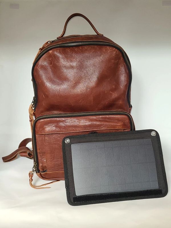 Image of brown leather Progenitor solar backpack from Blackboard Solar, Inc.