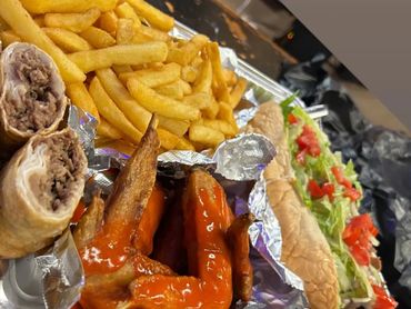 Philly specail sampler....... 8 inch cheesesteak wings and fries and