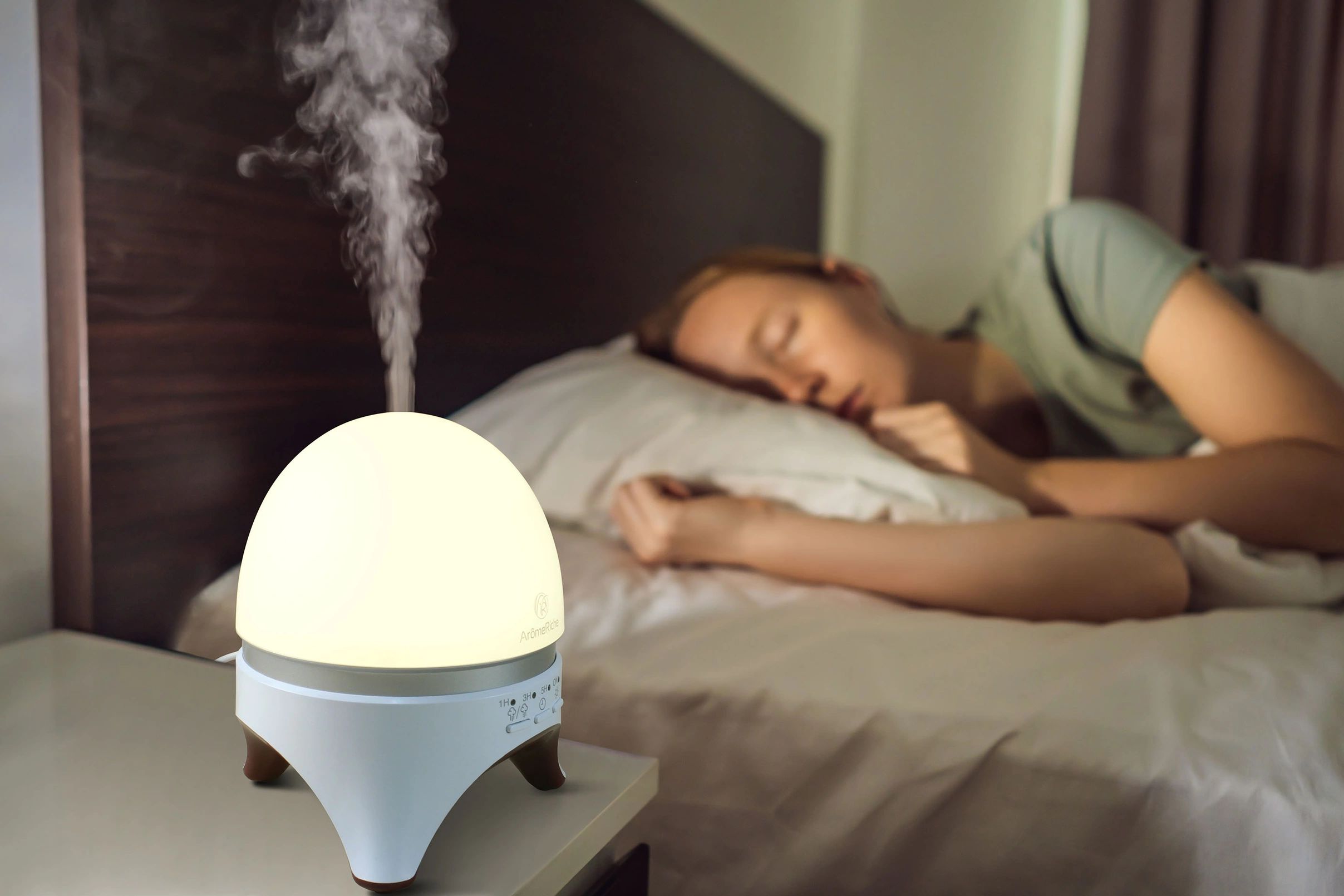 an atomiser in a bedroom with a lady sleeping