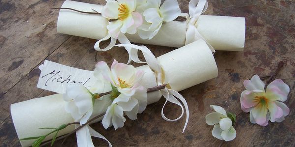 Blossom topped mini wedding favor crackers with hand written name tag