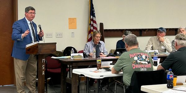 Mike Kriner addressing the conference attendees, discussing current regulatory and legislative affai