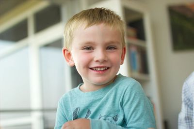 Young boy smiling.