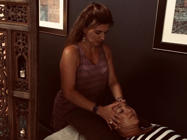 Reiki energy healing session at Age to Age Counseling in Albuquerque.