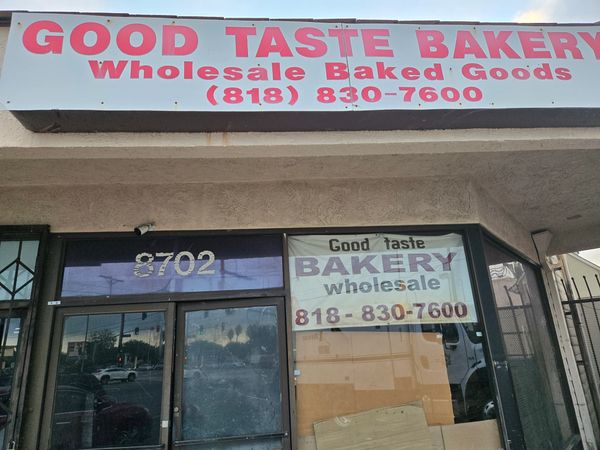 Good Taste Bakery sign with contact info.