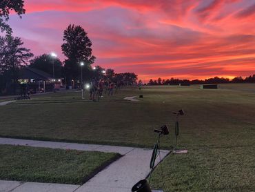 Trap shooting league night at Edwardsville Gun Club with members taking their shots at sunset