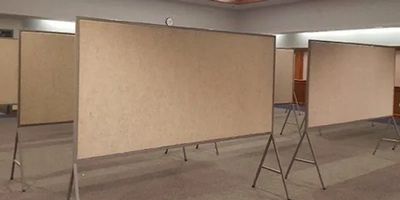 Empty bulletin boards in a room.